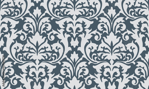 Seamless damask pattern in dark teal and white with intricate ornamental and floral elements.