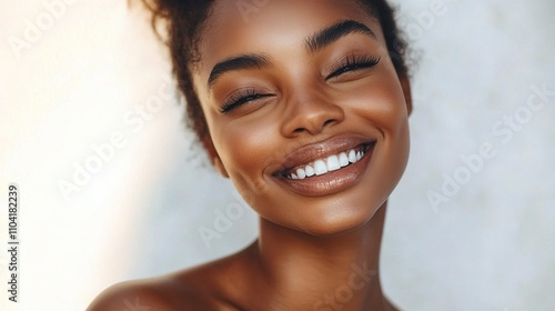 Joyful Woman Smiling in Natural Light with Radiant Skin Tone