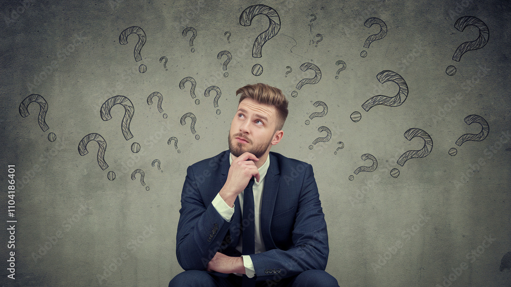 Businessman Contemplating Drawn Question Marks Businessman Contemplating Drawn Question Marks