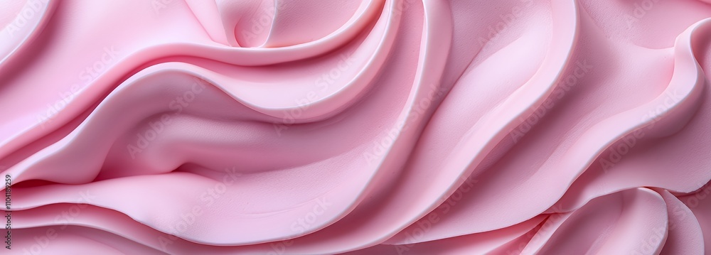 Obraz premium A close-up of smooth, flowing pink fabric creating a soft, elegant texture.