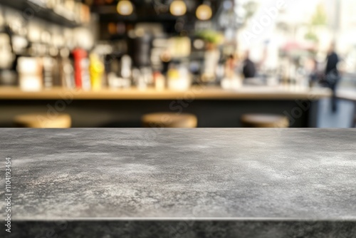 Empty bar counter with blurred background of bar interior and people.