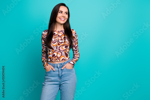 Photo of charming positive woman wear print shirt smiling looking empty space isolated teal color background