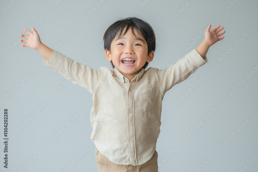 An Asian boy in a light beige shirt, jumping high with an expression of pure happiness An Asian boy in a light beige shirt, jumping high with an expression of pure happiness