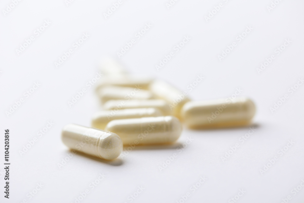 Alpha-lipoic acid capsules. Paper background. Soft focus. Close up. Copy space. Alpha-lipoic acid capsules. Paper background. Soft focus. Close up. Copy space.