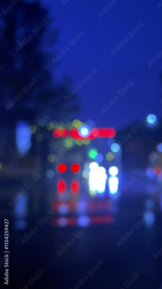 Vertical night 4K video. Blurred background. Red and white bokeh lights. Cars on street. Cityscape on roadway. City view. Concept of traffic jam, transport, road, speed, delivery, travel, trip. Way Vertical night 4K video. Blurred background. Red and white bokeh lights. Cars on street. Cityscape on roadway. City view. Concept of traffic jam, transport, road, speed, delivery, travel, trip. Way