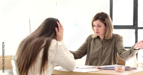 Female director yells at woman subordinate while throwing wrong documents slow motion. Manager covers head with hands. Work conflict in financial company