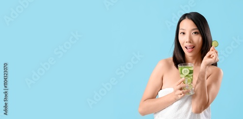 Beautiful Asian woman holdi...