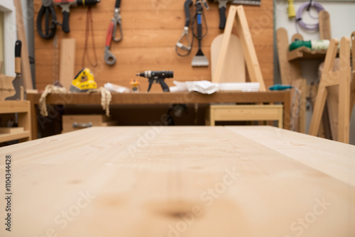 Empty wooden table in a carpentry workshop. Selective focus