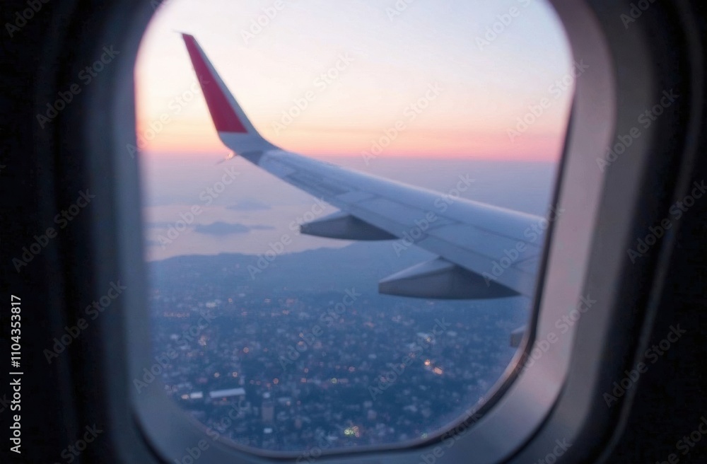 Glimpse of an airplane wing framed by a window, with a stunning sunset illuminating the urban area below during an evening flight. Generative AI Glimpse of an airplane wing framed by a window, with a stunning sunset illuminating the urban area below during an evening flight. Generative AI