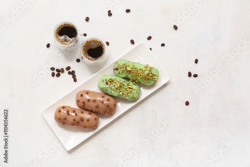 Plate with sweet eclairs an...
