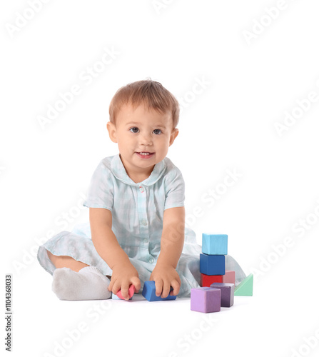 Cute baby girl playing with cubes on white background