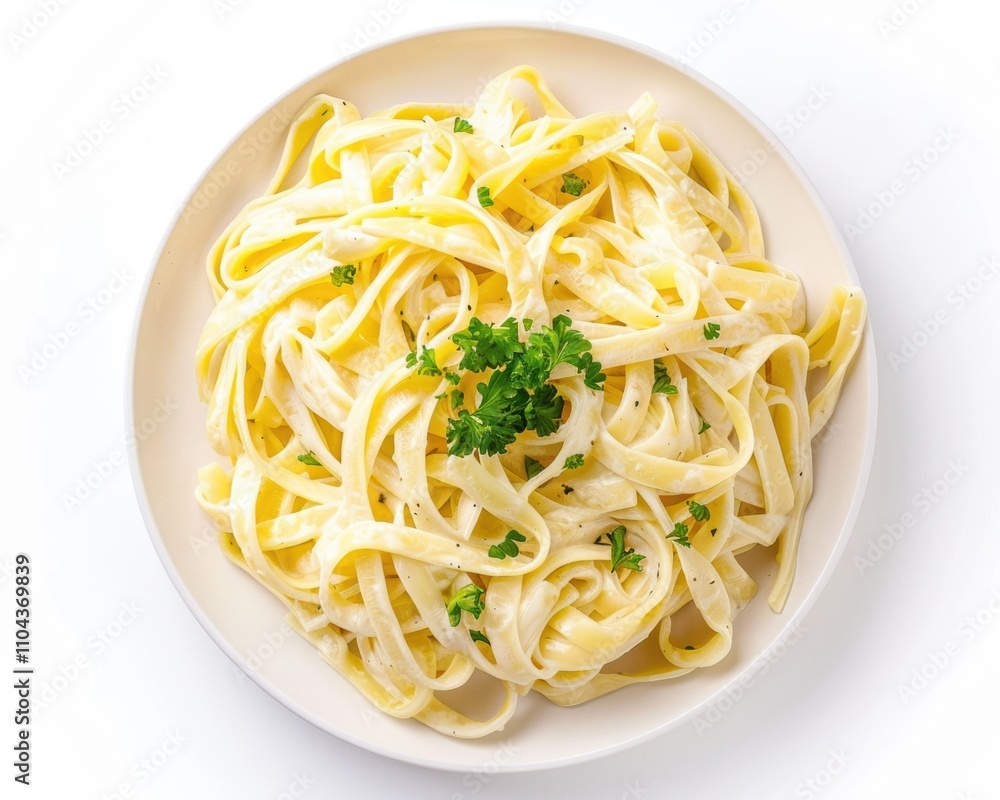 A plate of creamy fettuccine Alfredo garnished with fresh parsley. A plate of creamy fettuccine Alfredo garnished with fresh parsley.