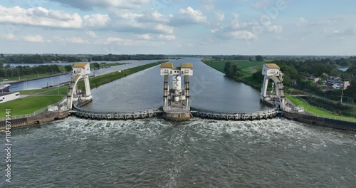 Aerial drone video on The Hagestein weir and lock complex is located in the Lek near the village of Hagestein. Hydroelectric power plant. photo