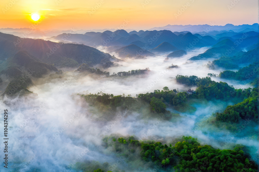Obraz premium A breathtaking aerial view of mist-covered mountains at sunrise, with golden light illuminating the serene landscape. Generative AI