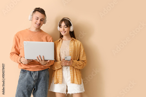 Young couple in headphones ...