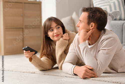 Young couple watching TV on...