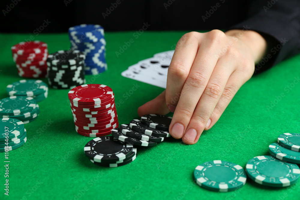 Woman with poker chips at green table, closeup Woman with poker chips at green table, closeup