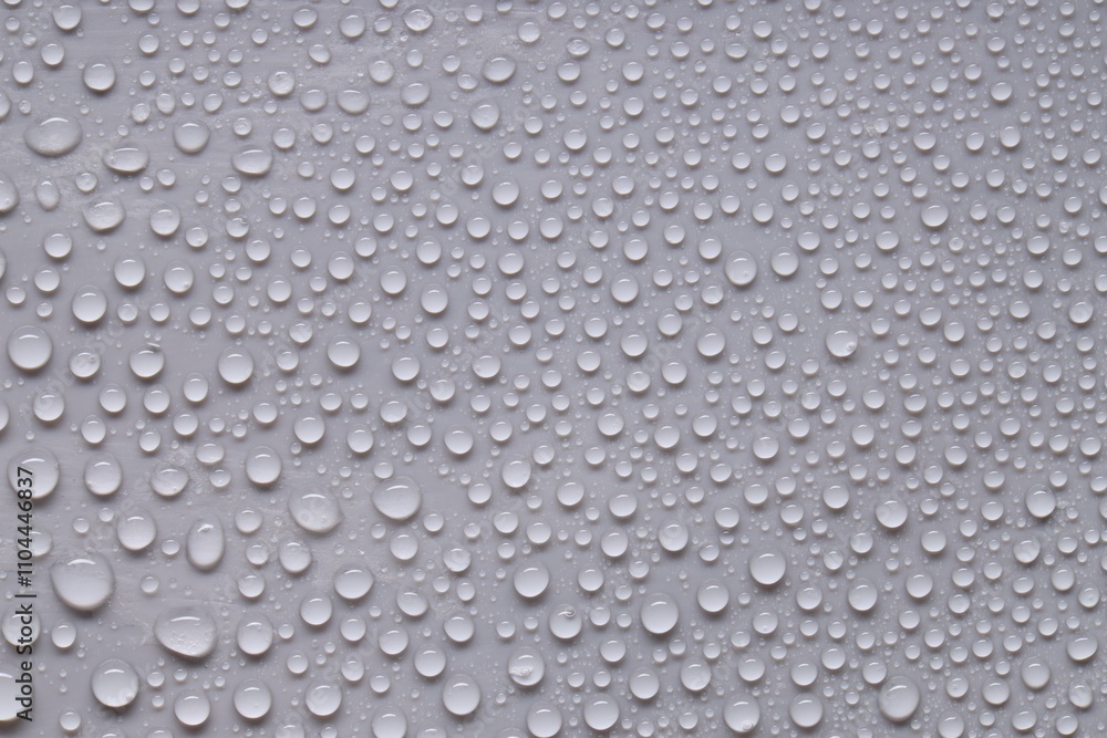 Water drops on gray background, top view Water drops on gray background, top view
