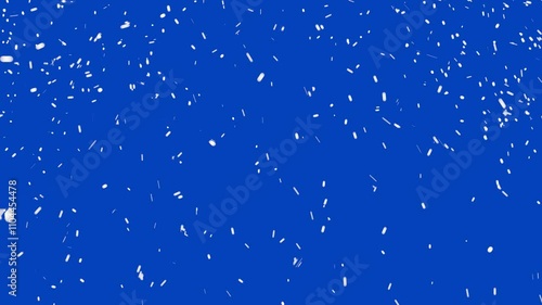 Snow is falling on a blue background. Christmas background