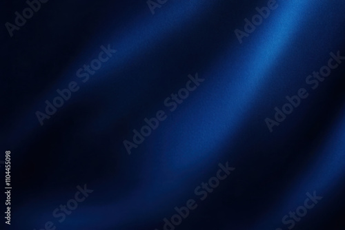 Abstract dark blue background. Silk satin. Navy blue color. Elegant background with space for design. Soft wavy folds.