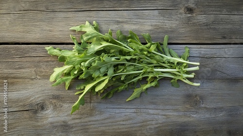 Shepherd?? purse, a fresh vegetable, rests on a wooden table, ready to be prepared. This edible plant offers a unique, slightly peppery flavor and is a versatile ingredient for salads, soups,