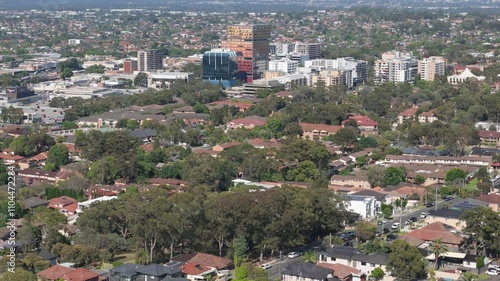 Aerial drone view of the east side of Bankstown cbd in Sydney NSW, Australia shot on a telephotos lens from above Greenacre in November 2024 photo