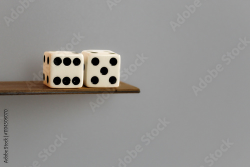 concept of sixty-five age retirement abstract pair of dice dices on wood plank diving board taking the plunge entertainment financial background template with space for copy photo