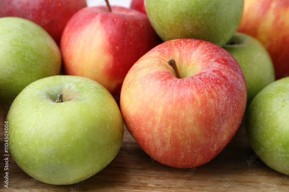 Fresh ripe apples on wooden table, closeup Fresh ripe apples on wooden table, closeup