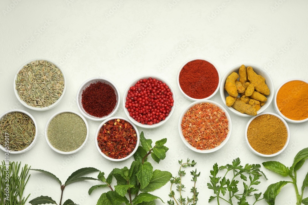 Different aromatic spices and herbs on white background, flat lay Different aromatic spices and herbs on white background, flat lay
