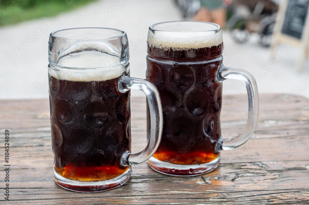 Two glasses of dark beer. Stout, porter, dunkel,dark beer. Friendship and relaxation, free time. Two glasses of dark beer. Stout, porter, dunkel,dark beer. Friendship and relaxation, free time.