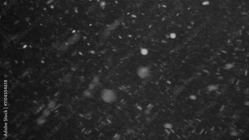 Snowfall on black background for winter-themed video effects Snowfall on black background for winter-themed video effects