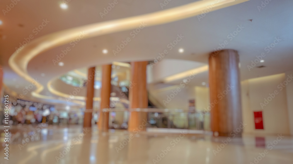 Blurry and Out of Focus Abstract Photo of a mall interior with large pillars and aesthetic light design. Perfect for background. Blurry and Out of Focus Abstract Photo of a mall interior with large pillars and aesthetic light design. Perfect for background.