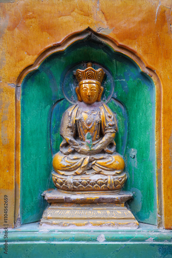 Fototapeta premium glazed Buddha on the wall of the Wisdom-Sea Temple, The Liangless Buddha Temple at the top of Wanshou Mountain in Summer Palace in Beijing.