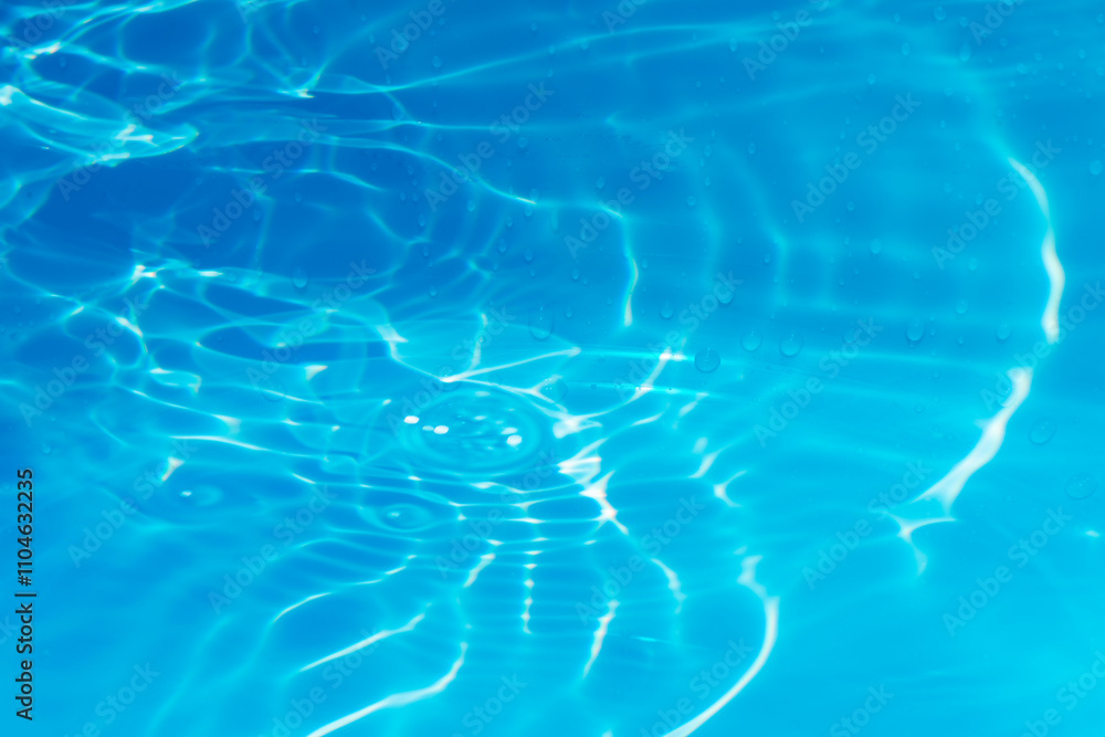 Blue water with ripples on the surface. Defocus blurred transparent blue colored clear calm water surface texture with splashes and bubbles. Water waves with shining pattern texture background. Blue water with ripples on the surface. Defocus blurred transparent blue colored clear calm water surface texture with splashes and bubbles. Water waves with shining pattern texture background.