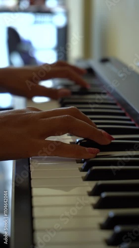 Woman Playing Digital Synthesizer Indoor. Close-Up Shot. Vertical Video