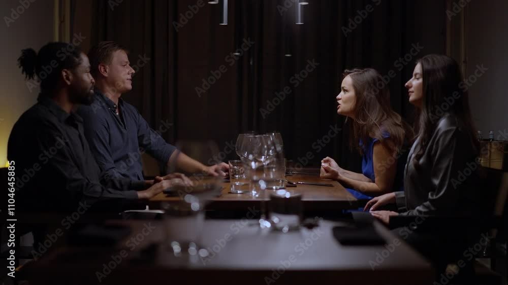 Two couples arguing in the restaurant Two couples arguing in the restaurant