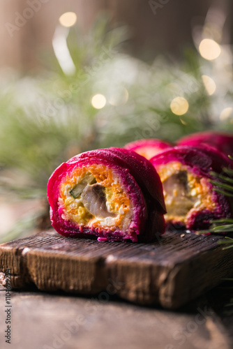 Shuba salad. Russian layered salad with beet, potato, carrot, pickled herring and mayonnaise for Christmas dinner. photo