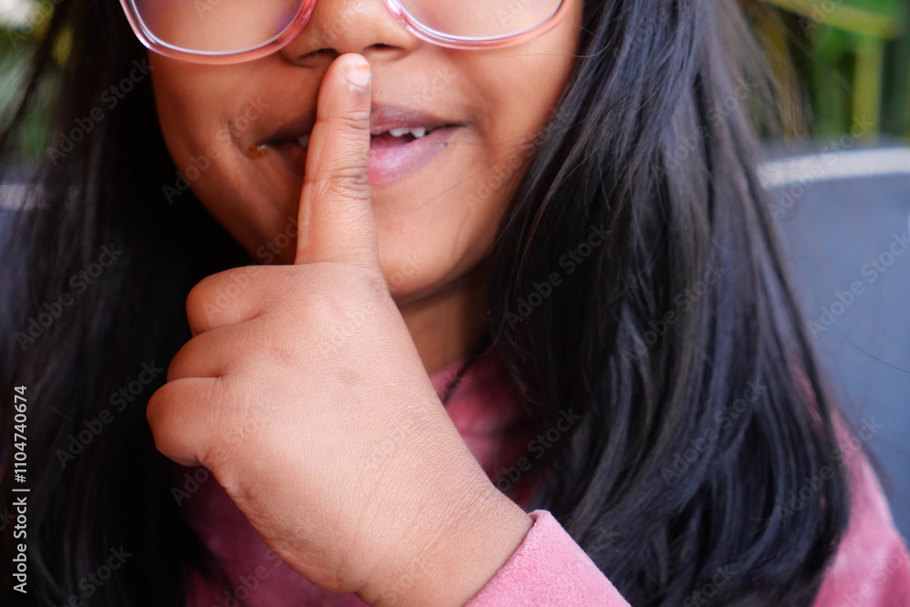 kid raising her hand indicating to stop talking or to be silent kid raising her hand indicating to stop talking or to be silent