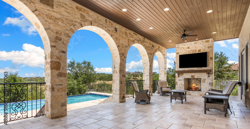 Elegant outdoor patio with pool view in a sunny location