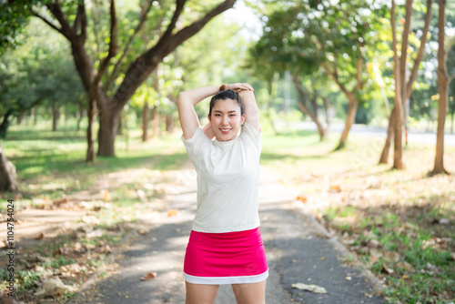 Asian women are stretching their muscles before going out to run to the park to keep themselves healthy and have beautiful puppets..