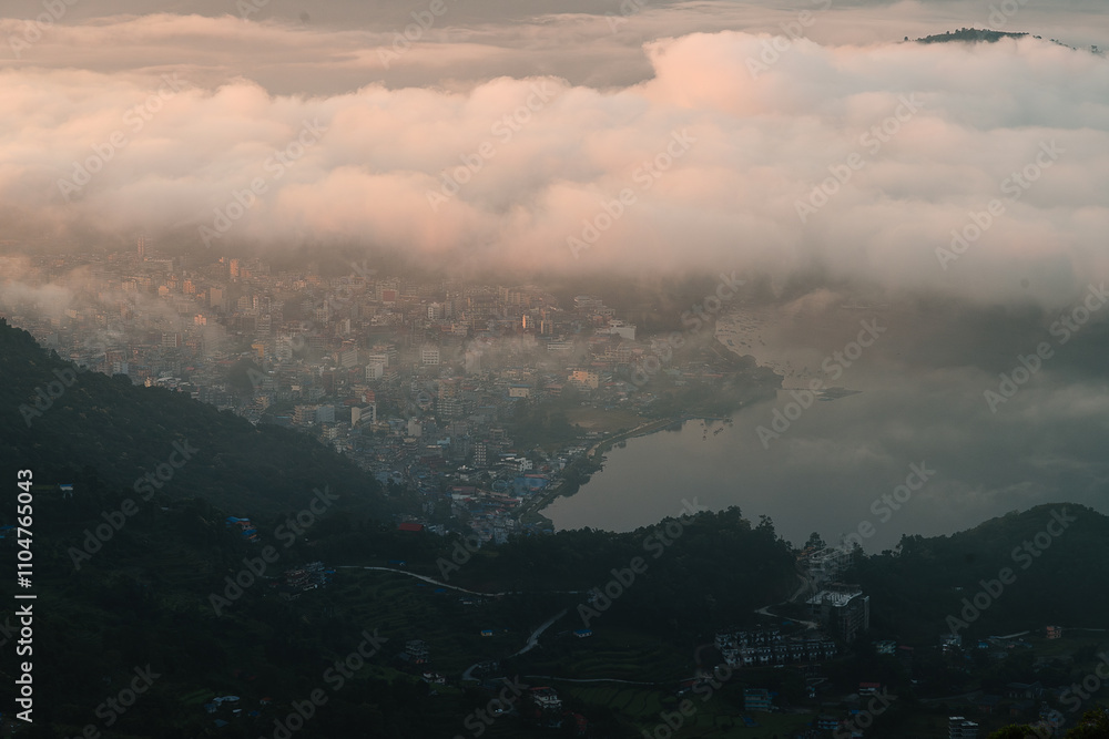 High angle view of cloudy and foggy panorama at sunrise near Phewa Lake in Pokhara, Nepal High angle view of cloudy and foggy panorama at sunrise near Phewa Lake in Pokhara, Nepal