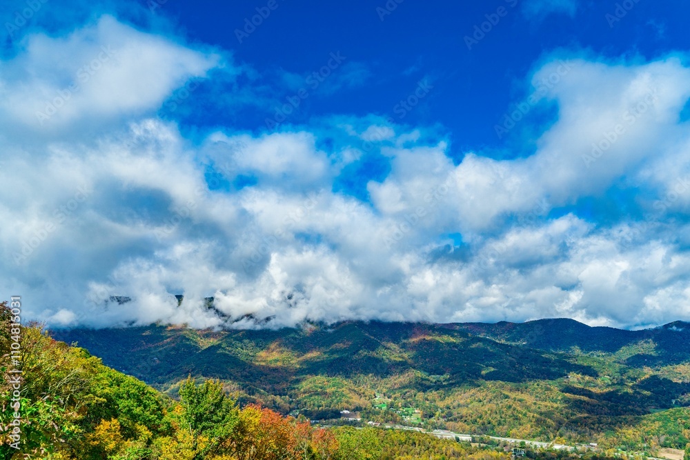 Vibrant autumn mountain landscape with dramatic clouds. Vibrant autumn mountain landscape with dramatic clouds.