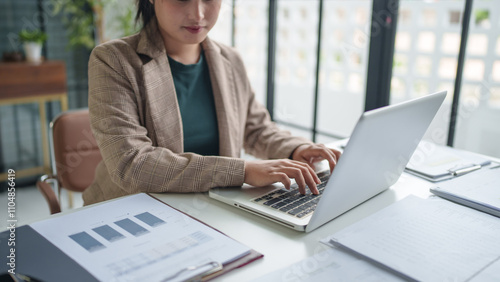 business woman working with laptop Hands typing keyboard. Professional investor working new start up project. business planning in office. Technology business.