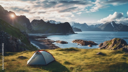 Breathtaking seaside campsite with towering mountain backdrop offering a serene and picturesque escape into nature s embrace  Tents nestled amidst the coastal landscape photo