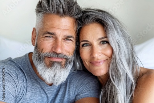 Couple enjoying a moment together with bright smiles in a cozy indoor setting
