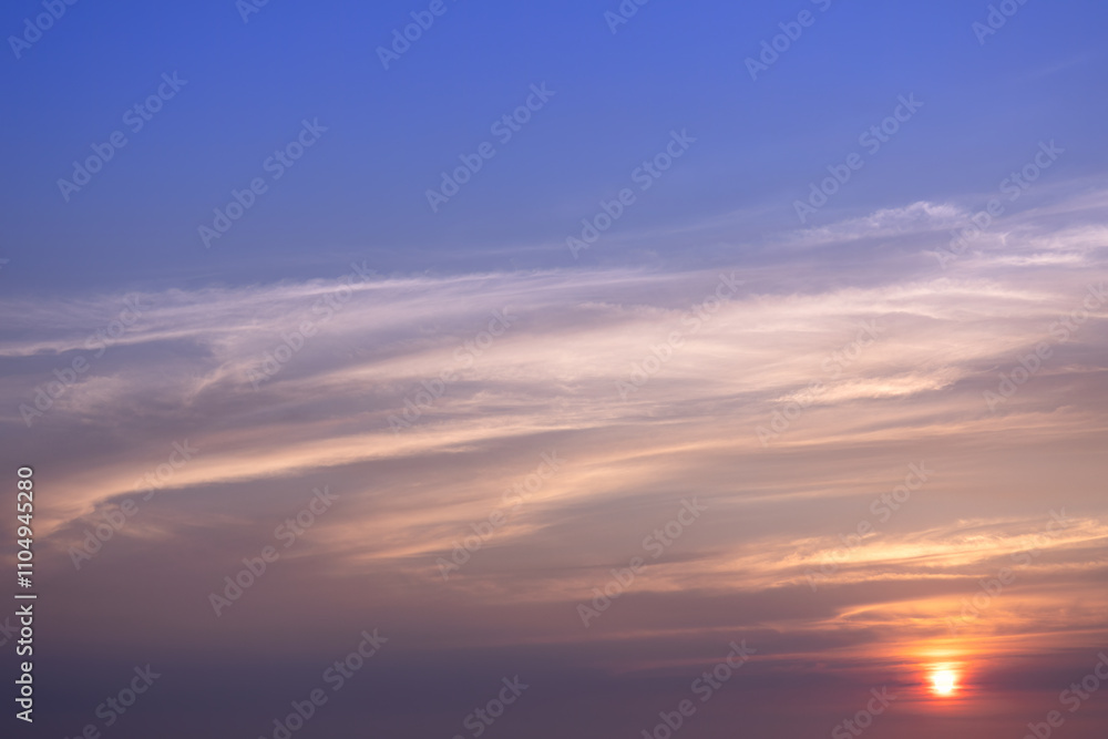 Dramatic sunset skies, cloudscape of rich color twilight sky. Sunset cloud background. Dramatic sunset skies, cloudscape of rich color twilight sky. Sunset cloud background.