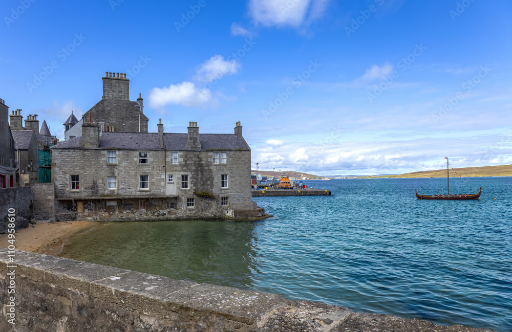 Lerwick, a coastal city in Shetland Scotland British Islands in England with scenic medieval houses. Lerwick, a coastal city in Shetland Scotland British Islands in England with scenic medieval houses.