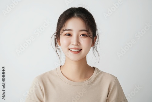 Portraits of Asian women in simple casual attire, standing against plain white background, wear minimal makeup display natural expressions, emphasizing modern, everyday style. photo