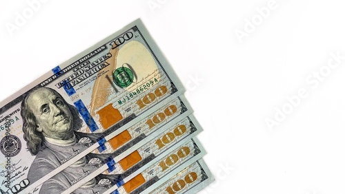 A fan arrangement of 100 U.S. bills on a white background, representing wealth, financial stability, and prosperity. Ideal for use in finance-related content, banking promotions, or investment adverti photo