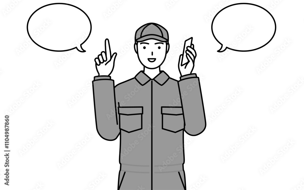 電話をしながら指さしをするつなぎ姿の整備士